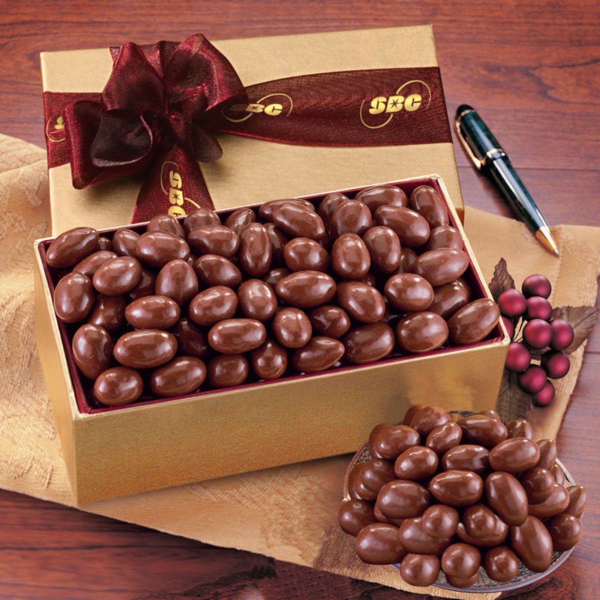 Chocolate covered almonds in gold gift box Corporate Specialties